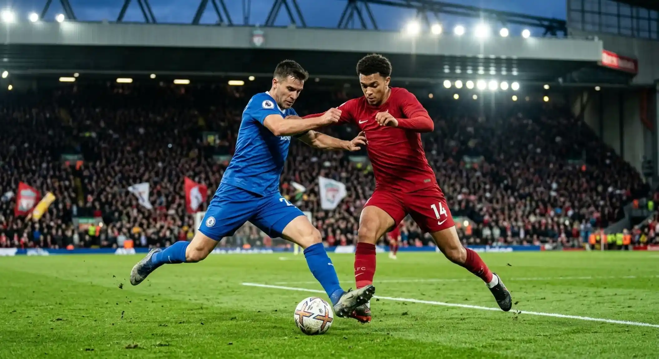 Due giocatori di squadre avversarie, uno in maglia blu e uno in maglia rossa, si contendono il pallone a centrocampo sotto i riflettori di uno stadio gremito